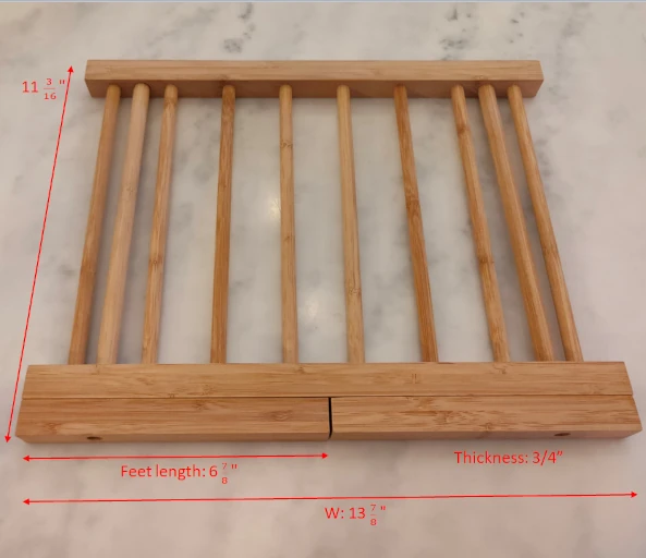 Pasta drying rack dimension when folded is 13 7/8 by 11 3/16 inch. Thickness is 3/4 inch.
